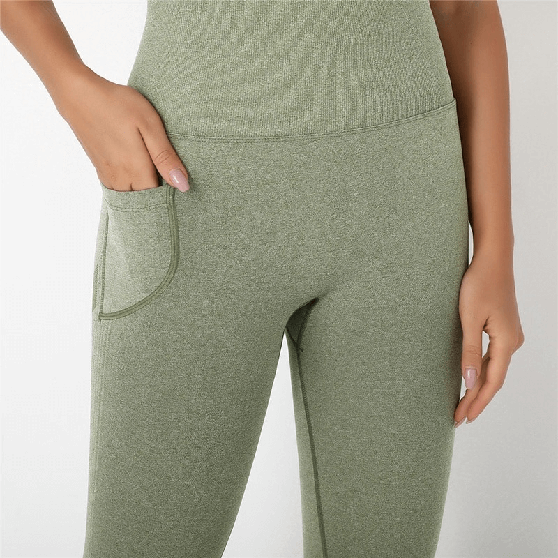 Close-up of a green seamless high-waist bodysuit for women, showcasing the pocket and comfortable fit for gym wear.