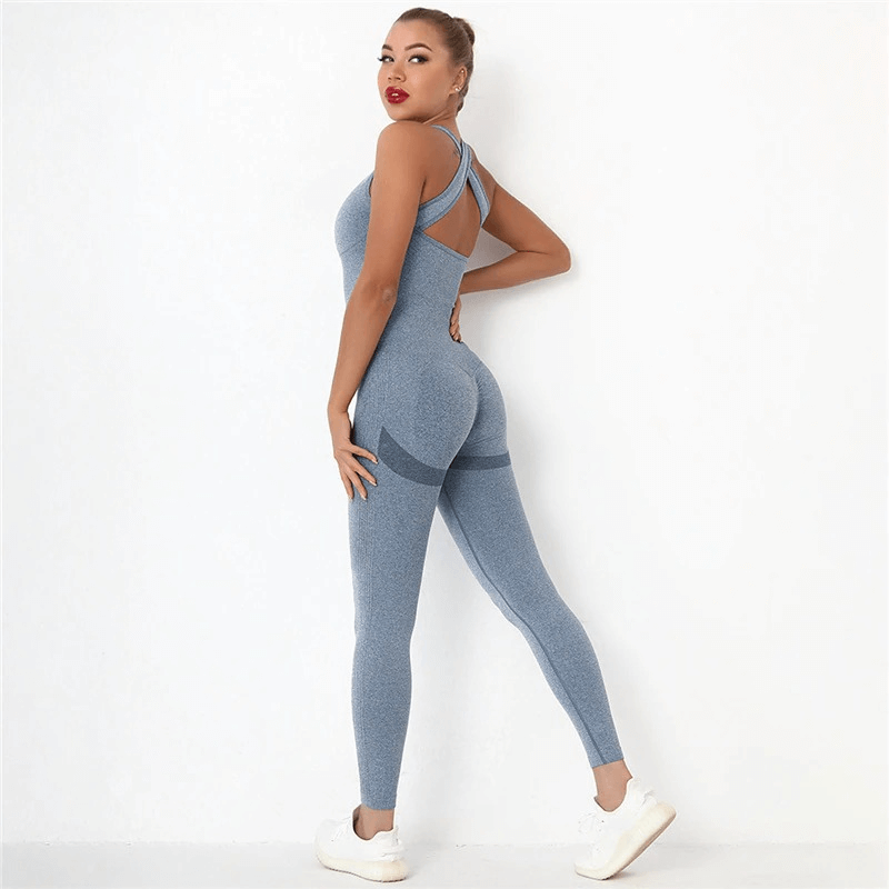 Woman wearing seamless high waist bodysuit for gym with hips push-up effect in blue, showcasing comfort and style for women's fitness clothing.