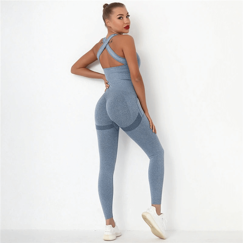 Woman wearing a blue seamless bodysuit with high waist and push-up feature, perfect for gym workouts, showcasing comfort and style.