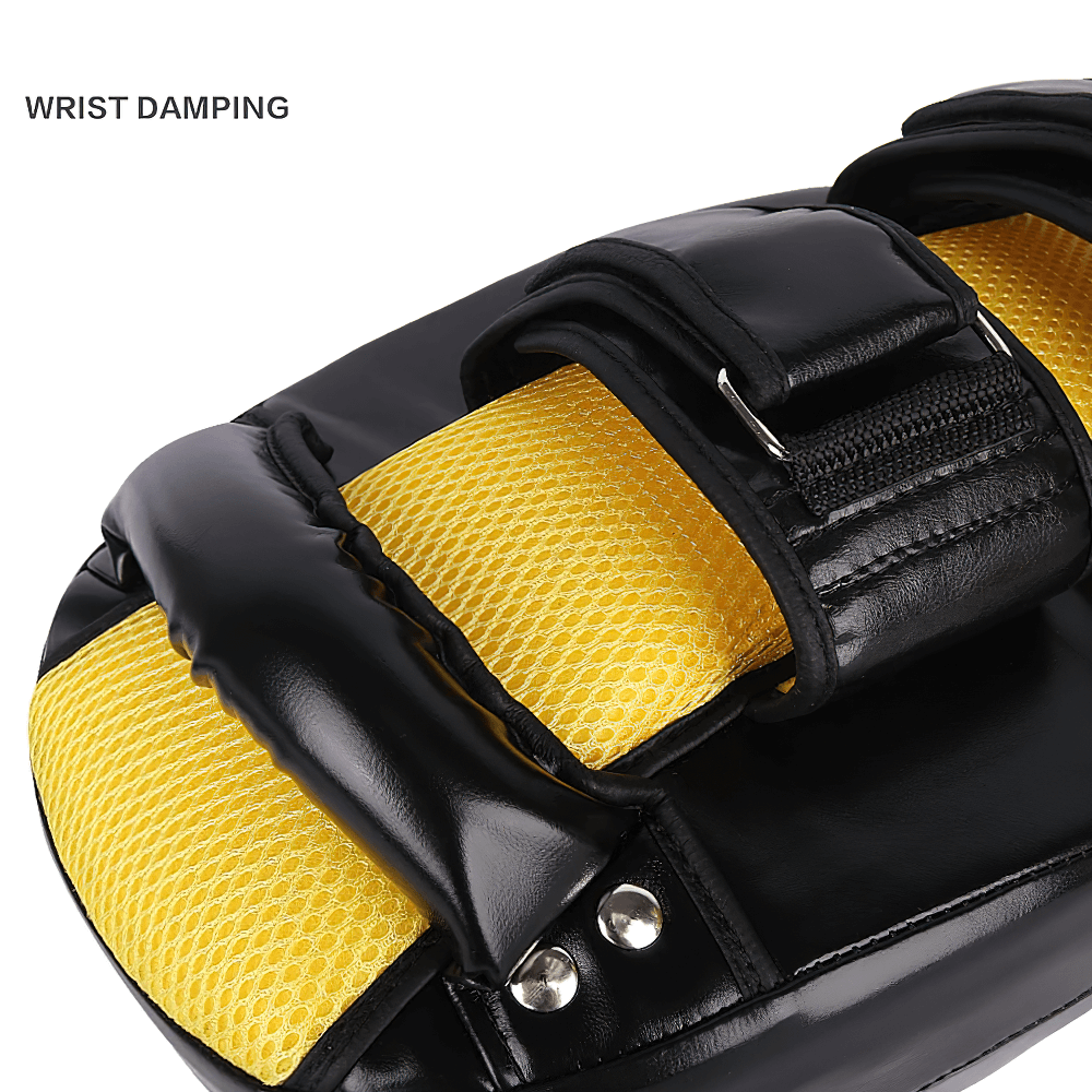 Muay Thai kick pad with dual arm straps and wrist damping feature, showcasing yellow mesh panel for airflow and black leather design.