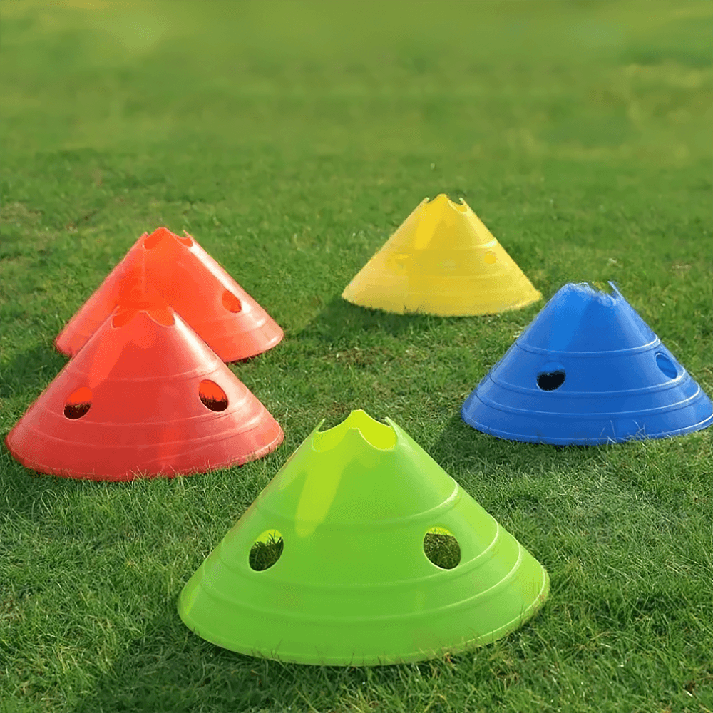Colorful 15cm agility training cones for soccer and football drills on grass