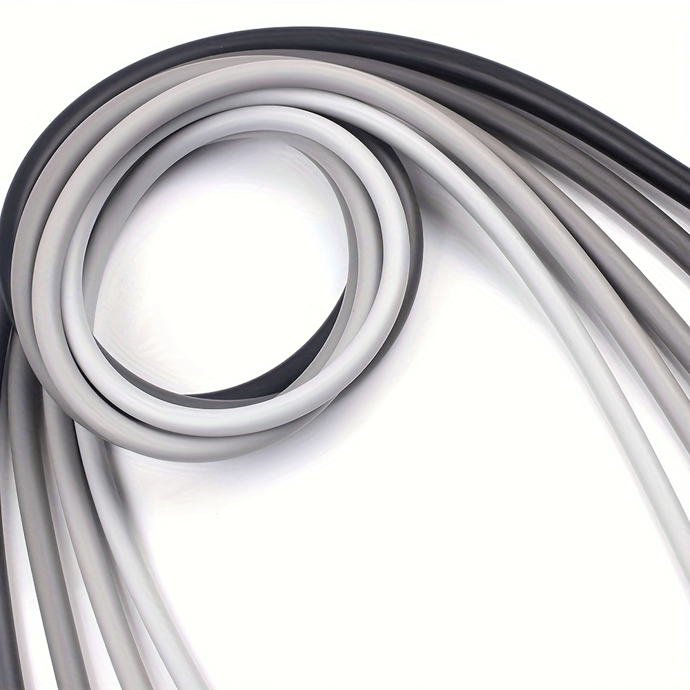 Close-up of stacked resistance bands in gray, white, and black from the 11-piece SF3004 home gym set, perfect for strength training.