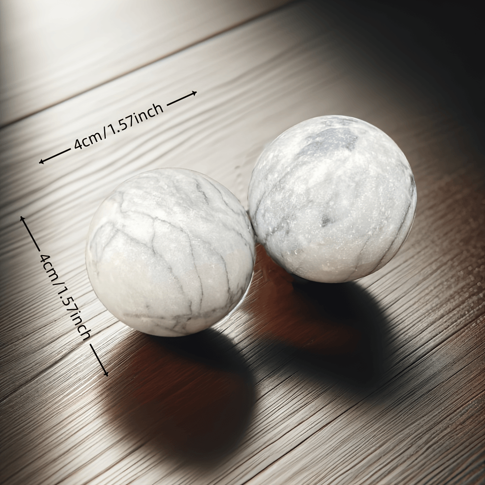 Pair of natural stone Baoding balls for relaxation and focus, measuring 4cm in diameter, on a wooden surface.