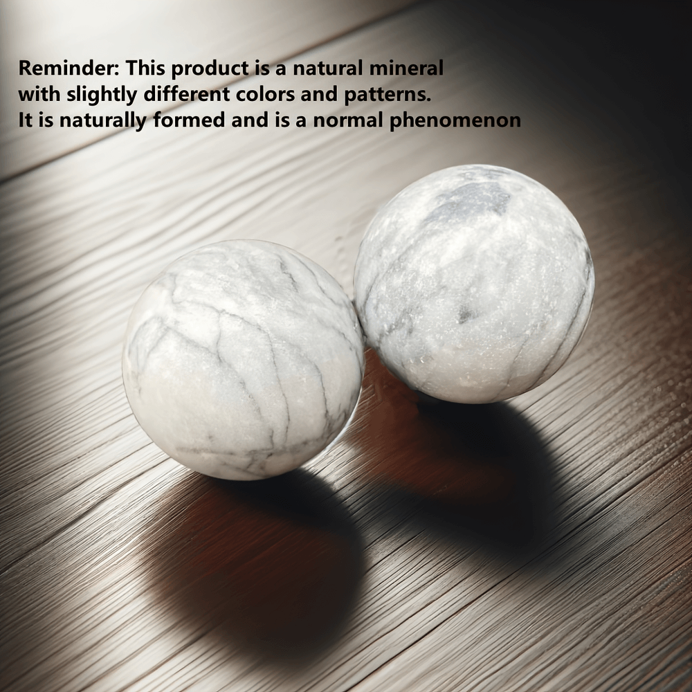 Natural stone Baoding balls for relaxation and focus on wooden surface, with unique patterns and stress-relieving benefits.