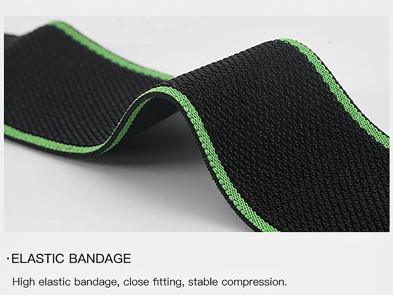 Close-up of a black and green elastic wrist support bandage for sports.