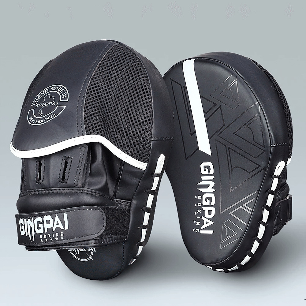 Black PU leather boxing target pads with ergonomic design and Velcro closure for training, sparring, and MMA.