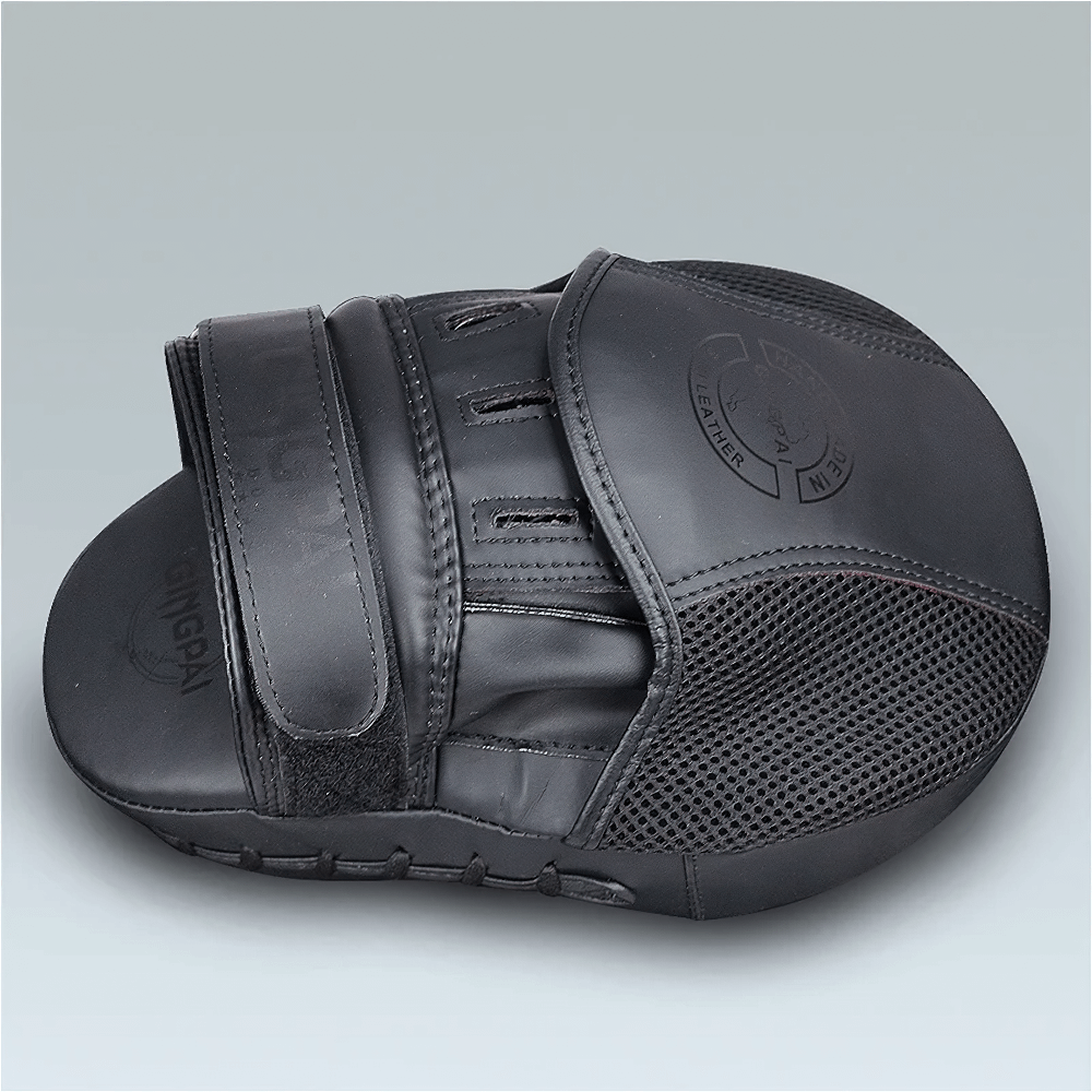 Black PU leather boxing target pad with Velcro closure for training and sparring, ergonomic design for impact absorption.