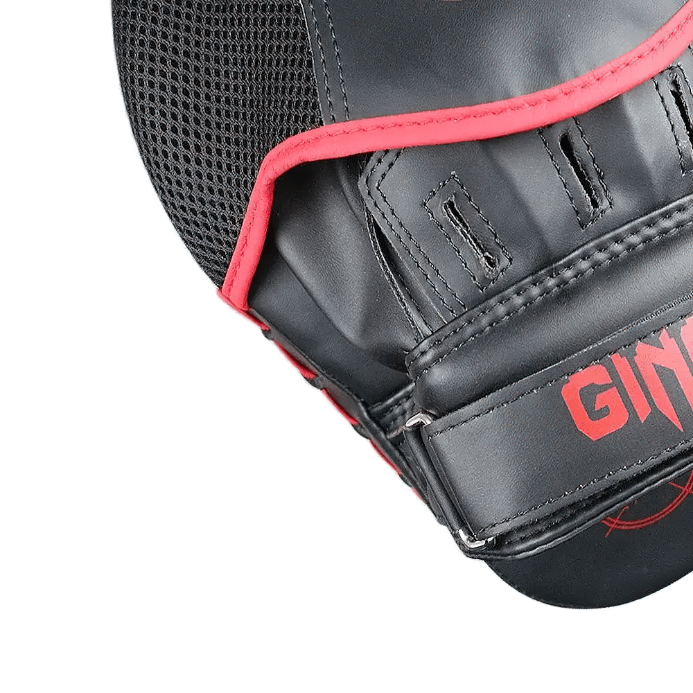 Close-up of PU leather boxing target pad with ergonomic design and secure Velcro closure for training and sparring.