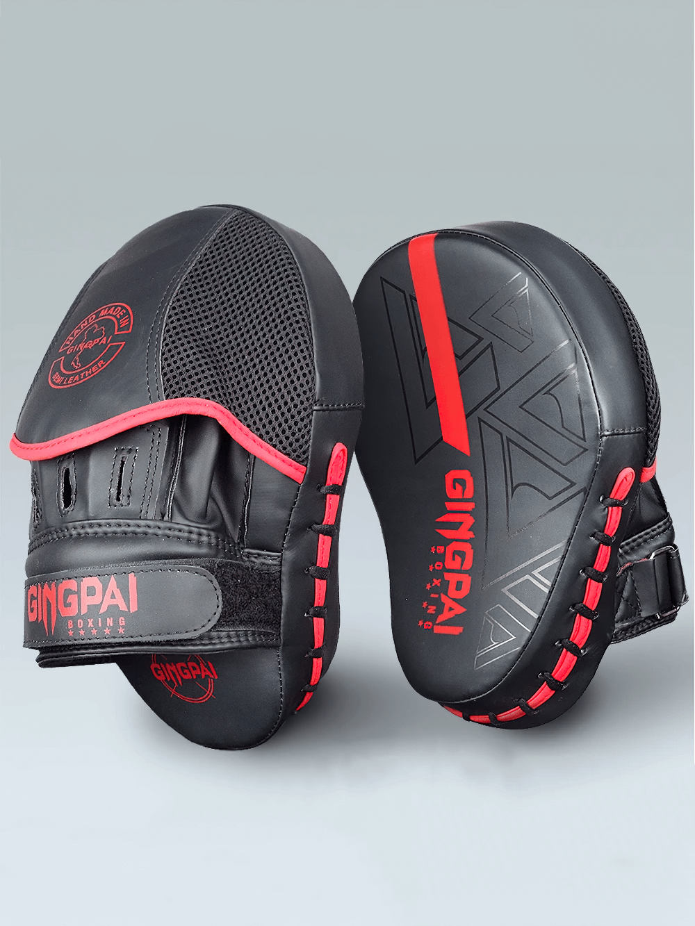 Black PU leather boxing target pads with red accents for effective training and sparring, featuring ergonomic design and secure Velcro closure.