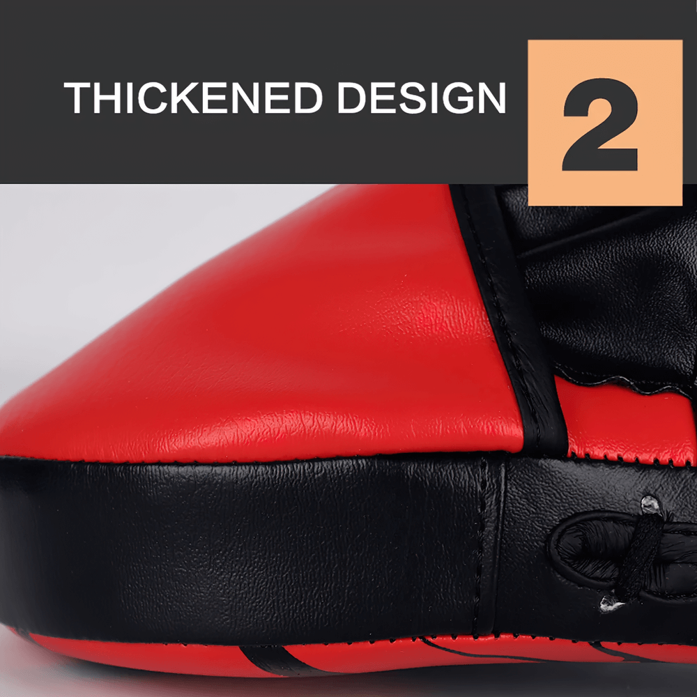 Close-up of red and black PU leather boxing punch mitt showing thickened design for enhanced durability and impact resistance.