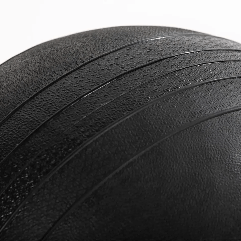 Close-up of a textured 20 LB rubber slam ball for power training and core conditioning.