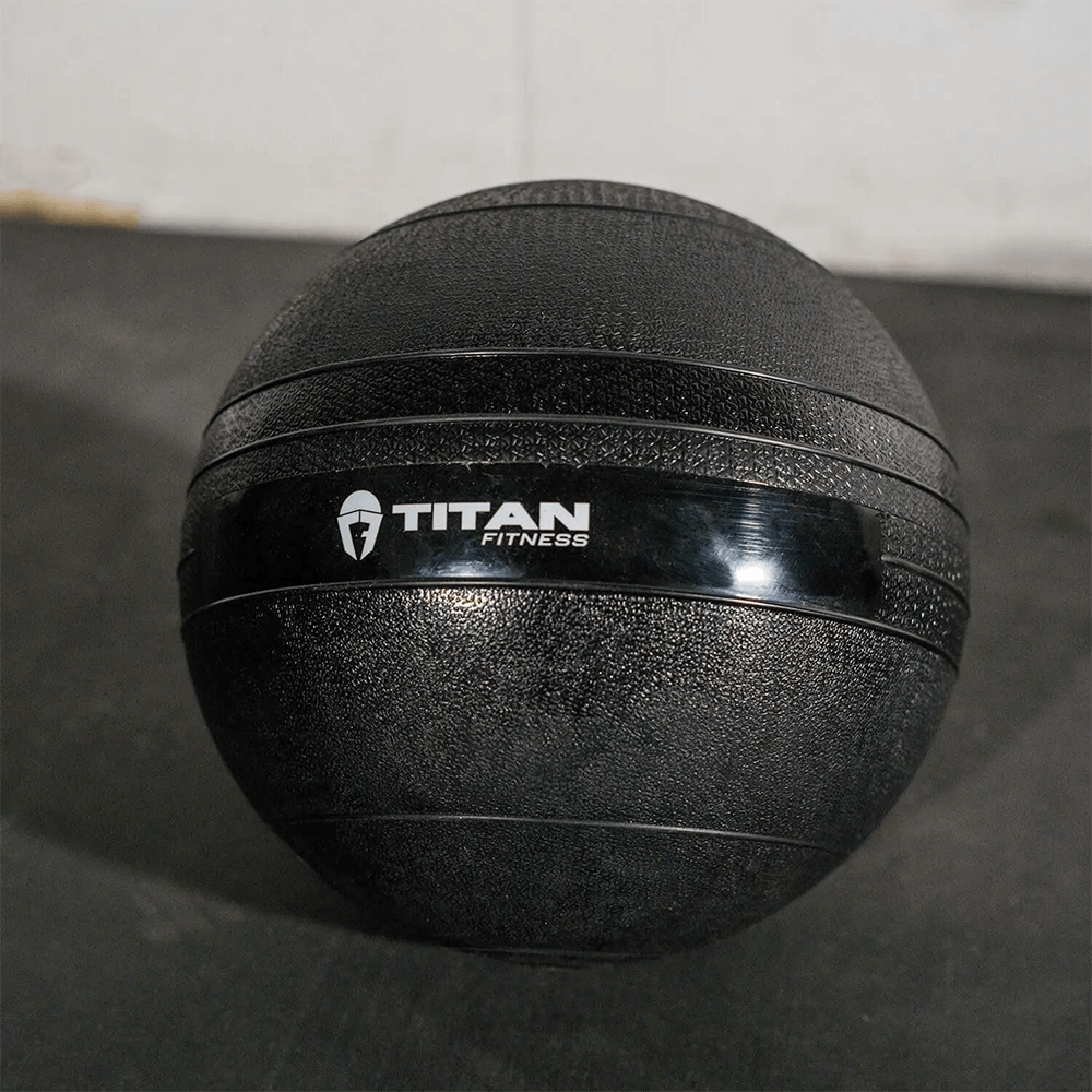 20 LB rubber slam ball by Titan Fitness, ideal for power training and conditioning with secure grip and minimal bounce.