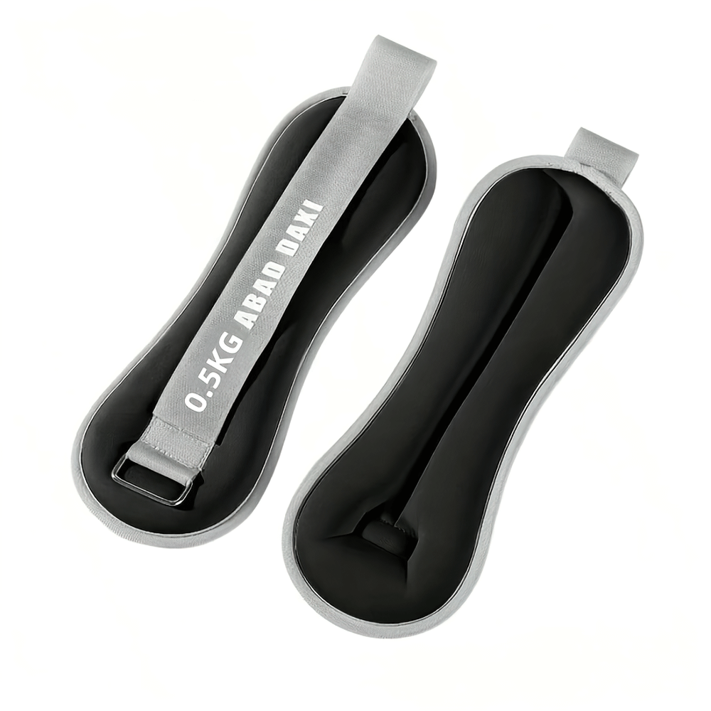 Pair of gray adjustable ankle and wrist weights for yoga and fitness, featuring secure hook-and-loop closure for stability.