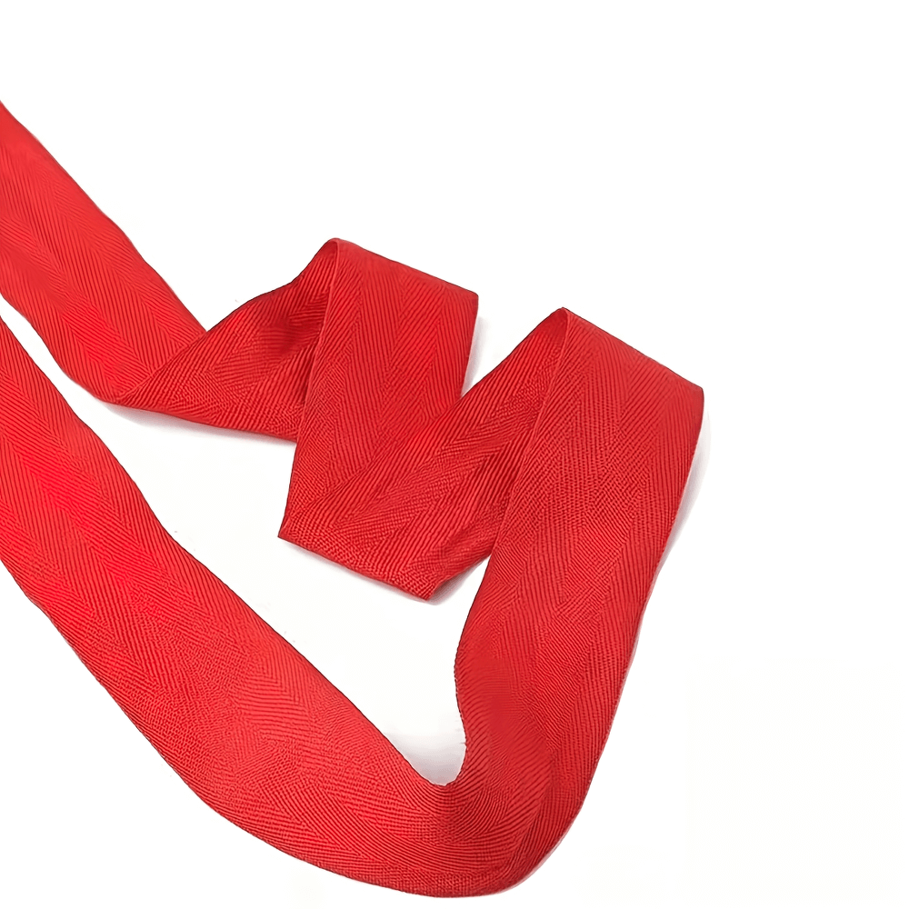 Red boxing hand wrap with stretchable fabric, perfect for wrist support in boxing and kickboxing training, featuring hook and loop closure.