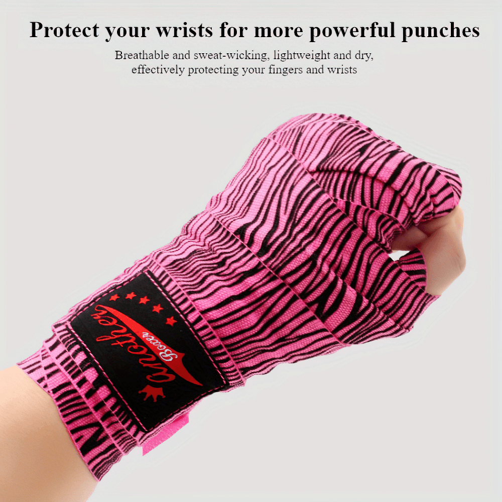 Pink breathable wrist support boxing wrap with thumb loop for MMA and kickboxing, enhancing protection and performance.