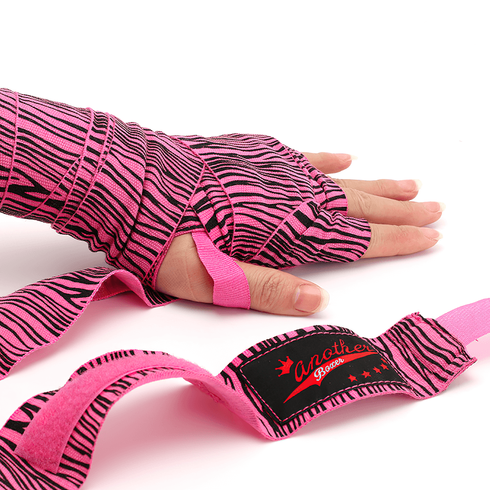 Pink zebra print boxing hand wraps providing wrist support for MMA and kickboxing, featuring secure thumb loop and breathable material.