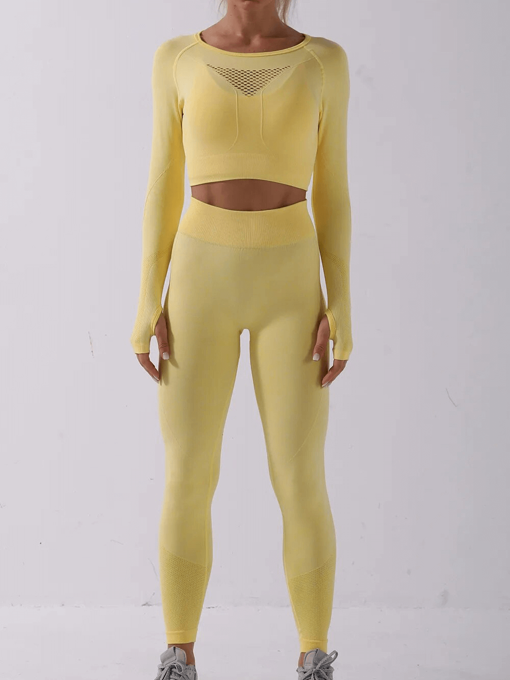 Yellow seamless women's yoga set, long-sleeve top and leggings, nylon material, perfect for sports, anti-shrink and windproof.