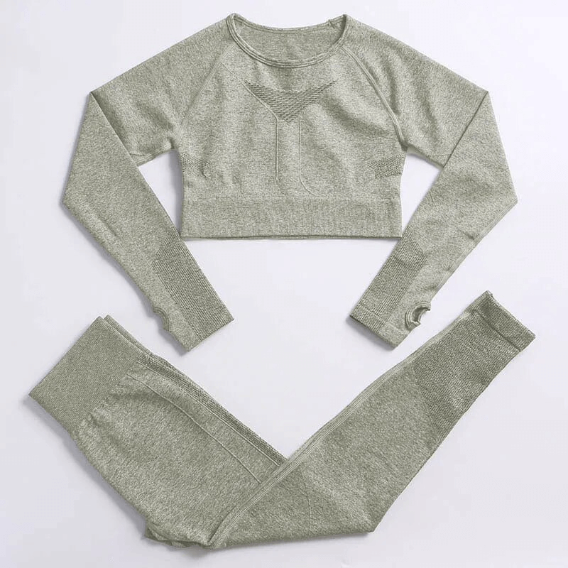 Green seamless women's yoga set with long sleeves, ideal for sports and comfort, made from windproof nylon for female yogis, model SF1673.