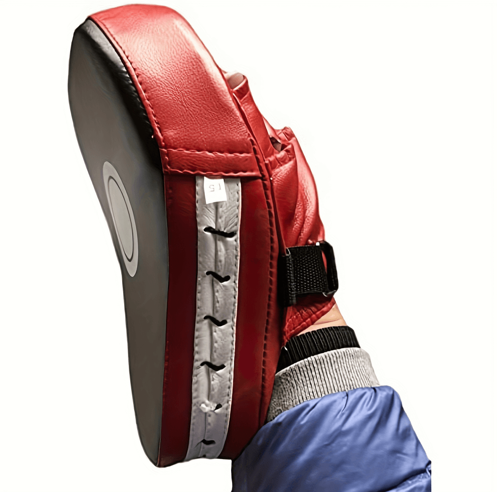 Boxing focus pad for martial arts, showcasing red PU leather, durable construction, secure grip, perfect for sparring and training.