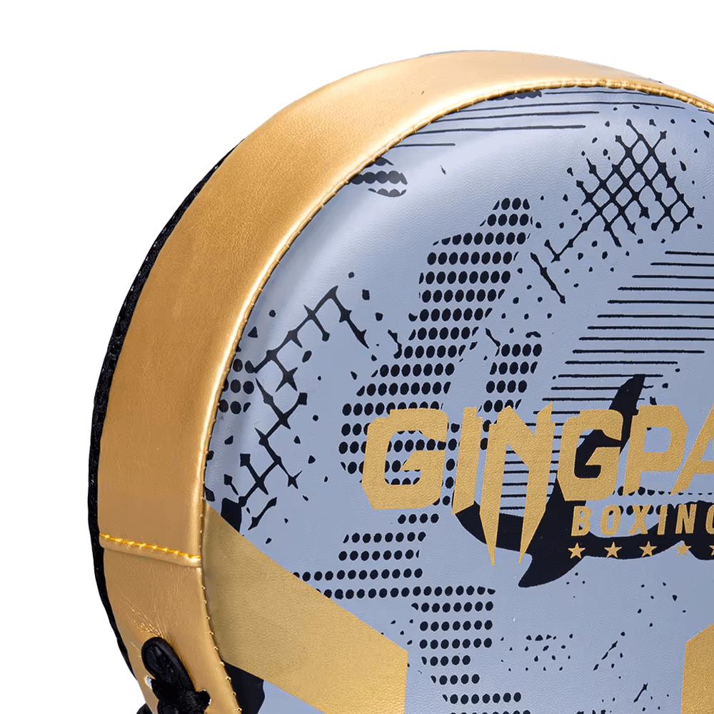 Close-up view of a boxing pad with a stylish design, featuring bold graphics and durable material. Ideal for training and sparring sessions.