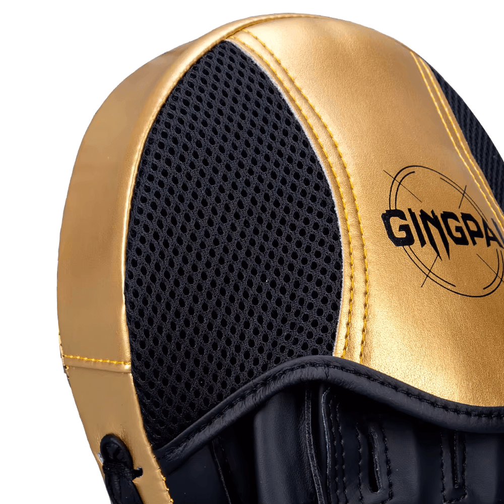 Gold and black boxing focus mitt, ergonomic design for training, perfect for improving speed and accuracy in boxing and MMA sparring.