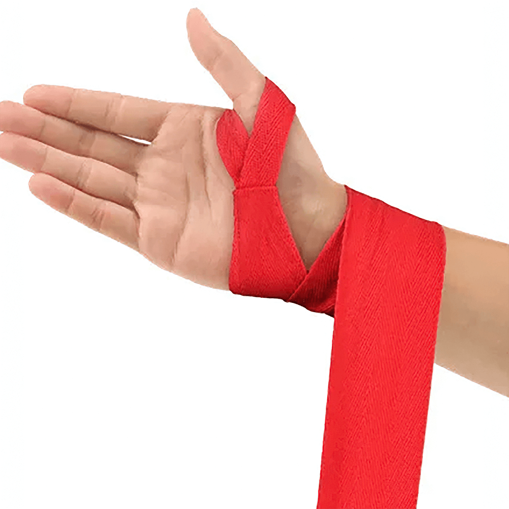 Red 3M Muay Thai hand wrap being applied to a hand for combat sports training.