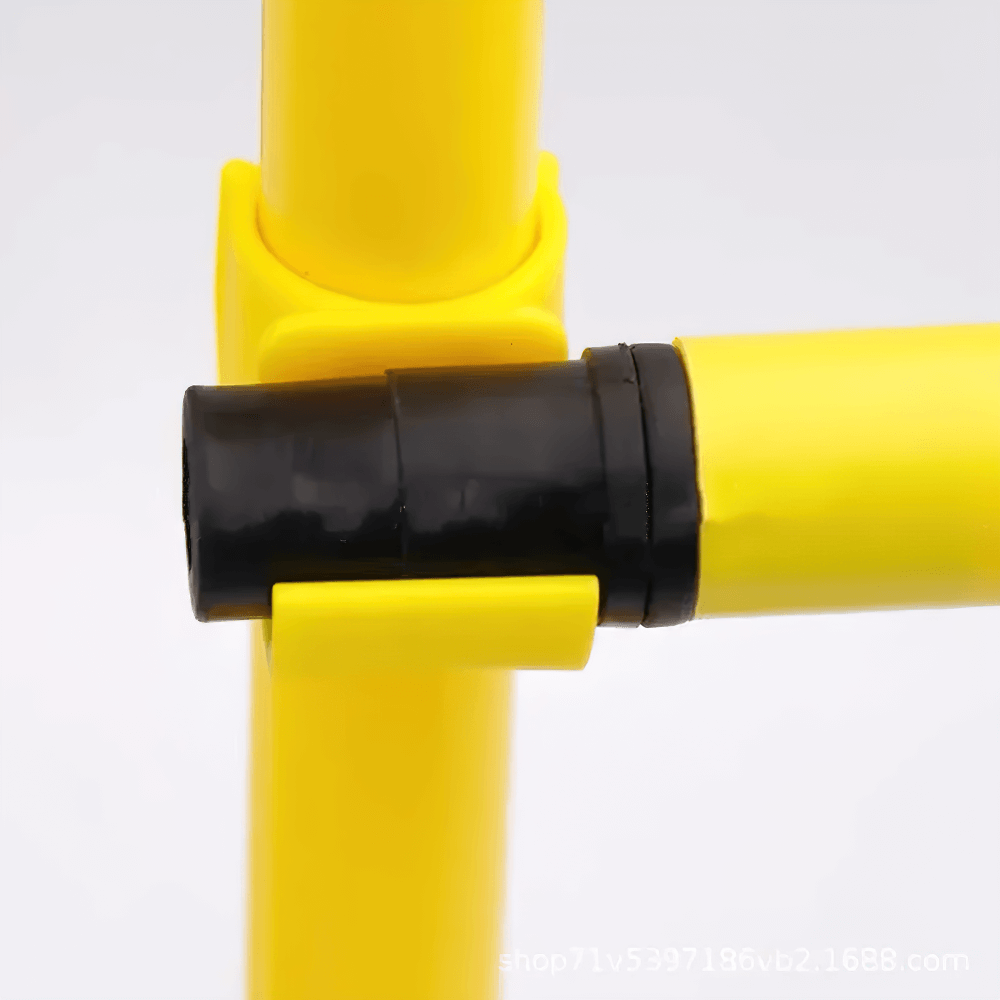 Close-up of yellow foldable soccer agility pole connection with sturdy build.