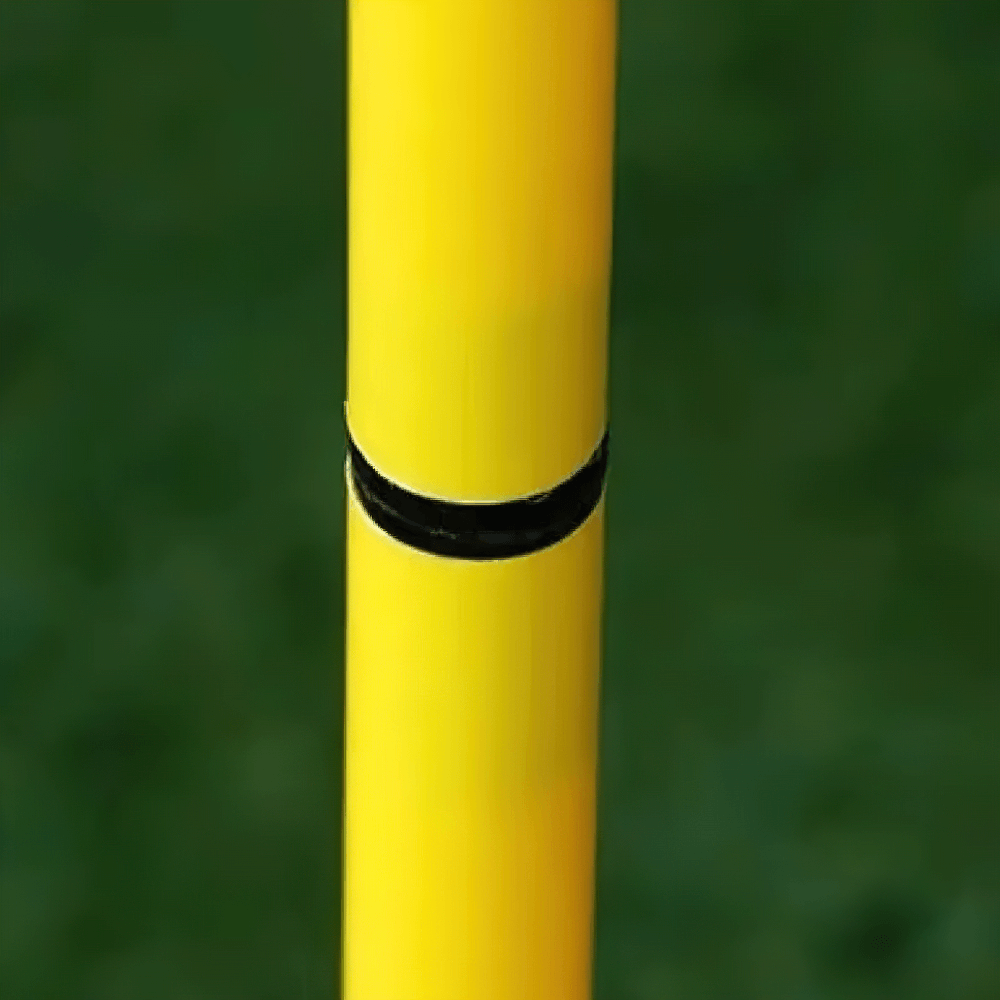 Close-up of a yellow agility pole connection, highlighting secure join for soccer speed training drills.