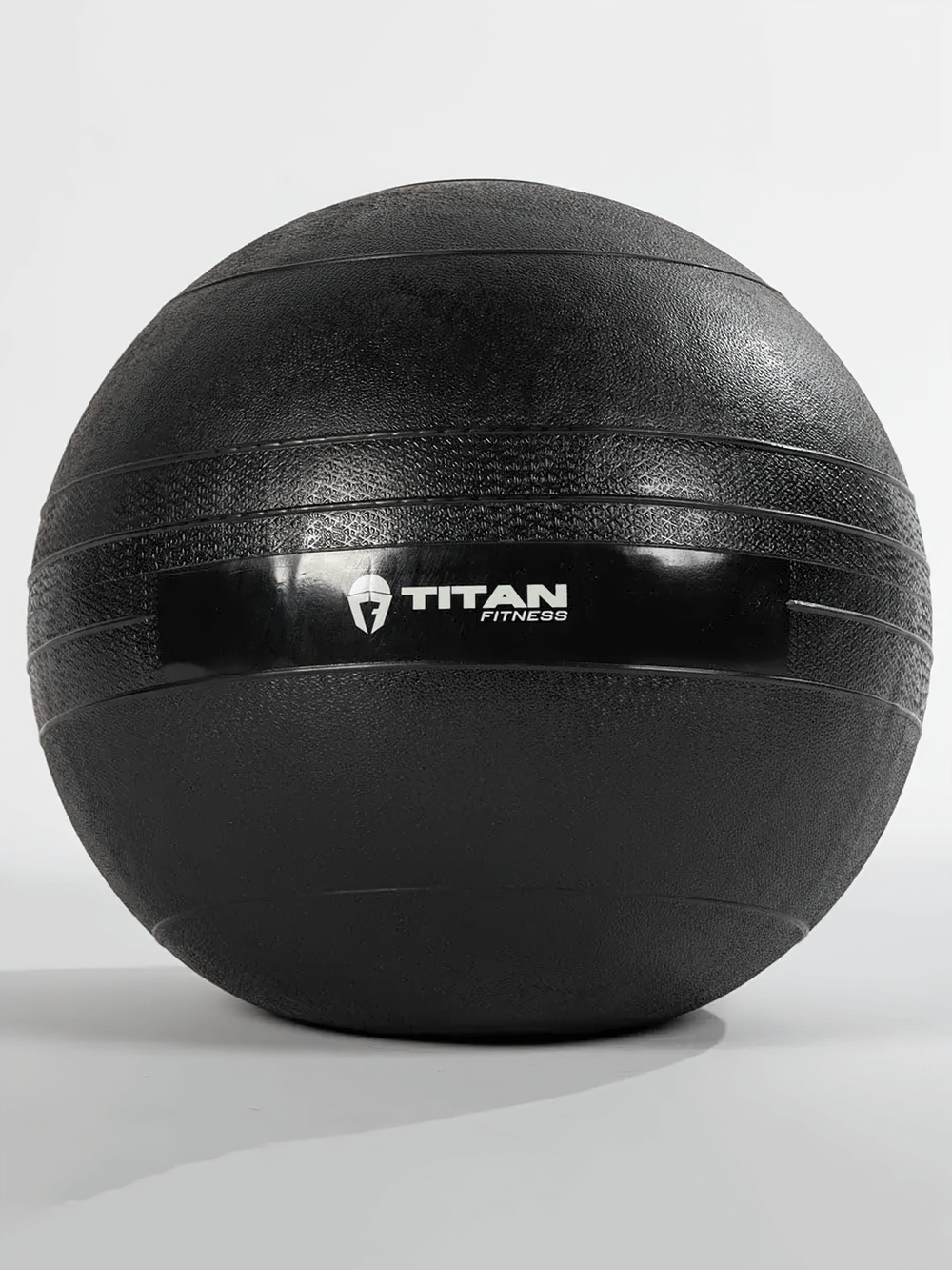 35 LB Rubber Slam Ball for Cross Training with textured surface for grip by Titan Fitness, ideal for strength and conditioning workouts.