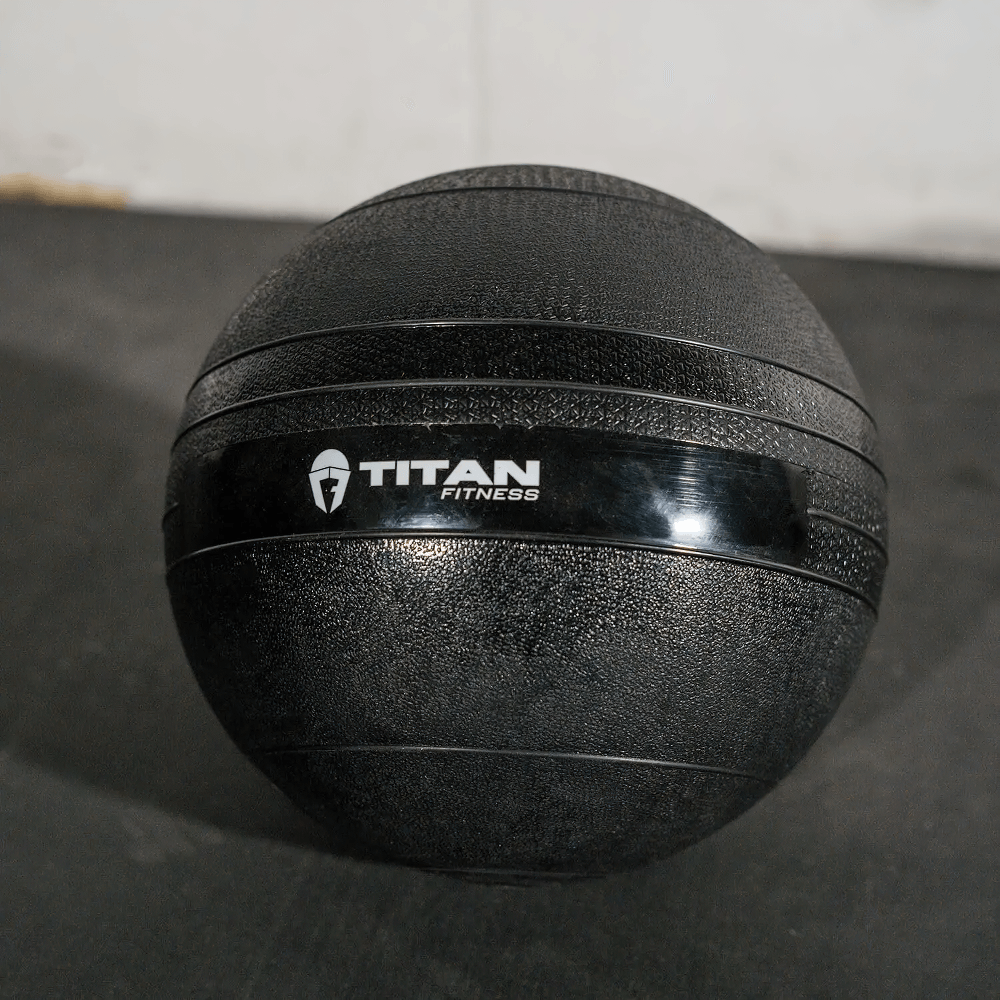 35 LB rubber slam ball for cross training, strength, and conditioning exercises, featuring a textured surface for secure grip.