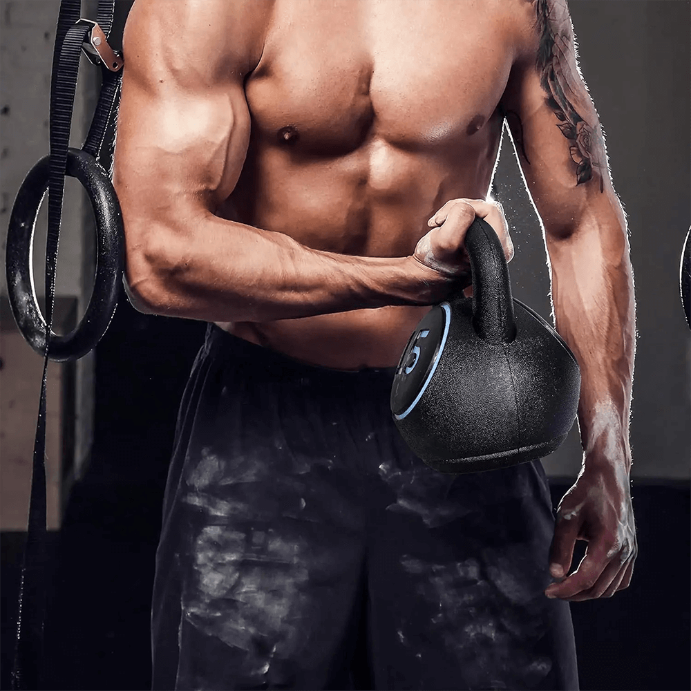 Athlete lifting a kettlebell during strength training workout at home gym.
