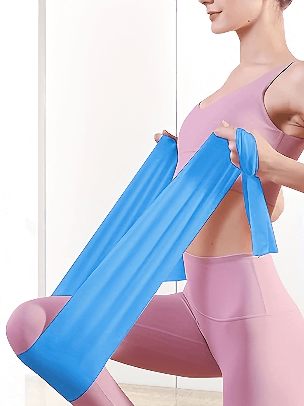 Person using blue resistance band for strength training at home