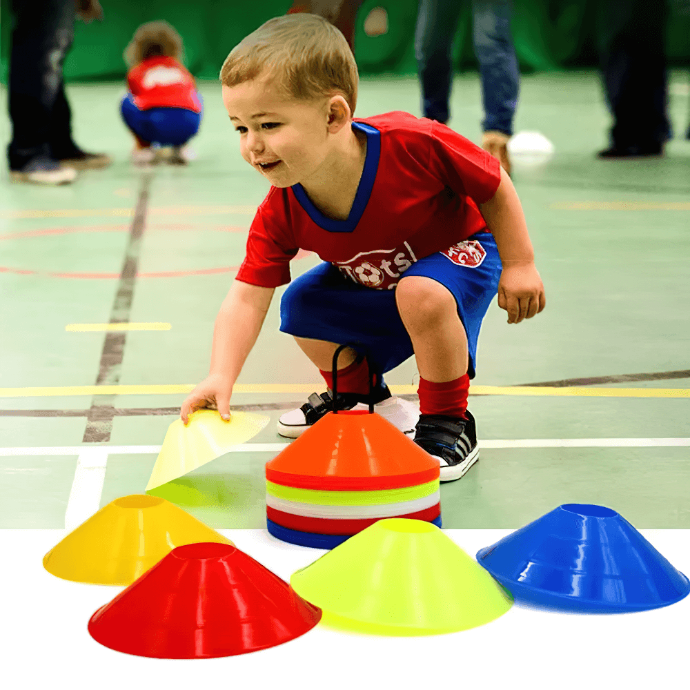 Child playing with colorful agility cones during a sports drill, showcasing the vibrant 50pcs agility cone set with mesh bag.