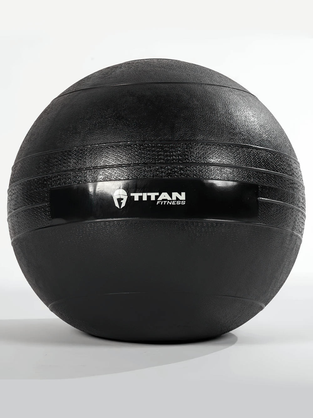 55 LB Titan Fitness rubber slam ball with textured grip for cross training and explosive workouts.