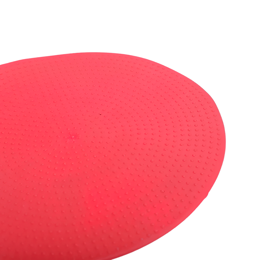 Close-up of a textured red soccer training marker mat for agility and court drills, part of a 60-piece set with grippy surface.