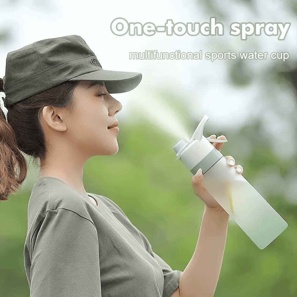 Person using 650ml Spray Water Bottle for Outdoor Activities - SF3492 with mist function for cooling during outdoor adventures.