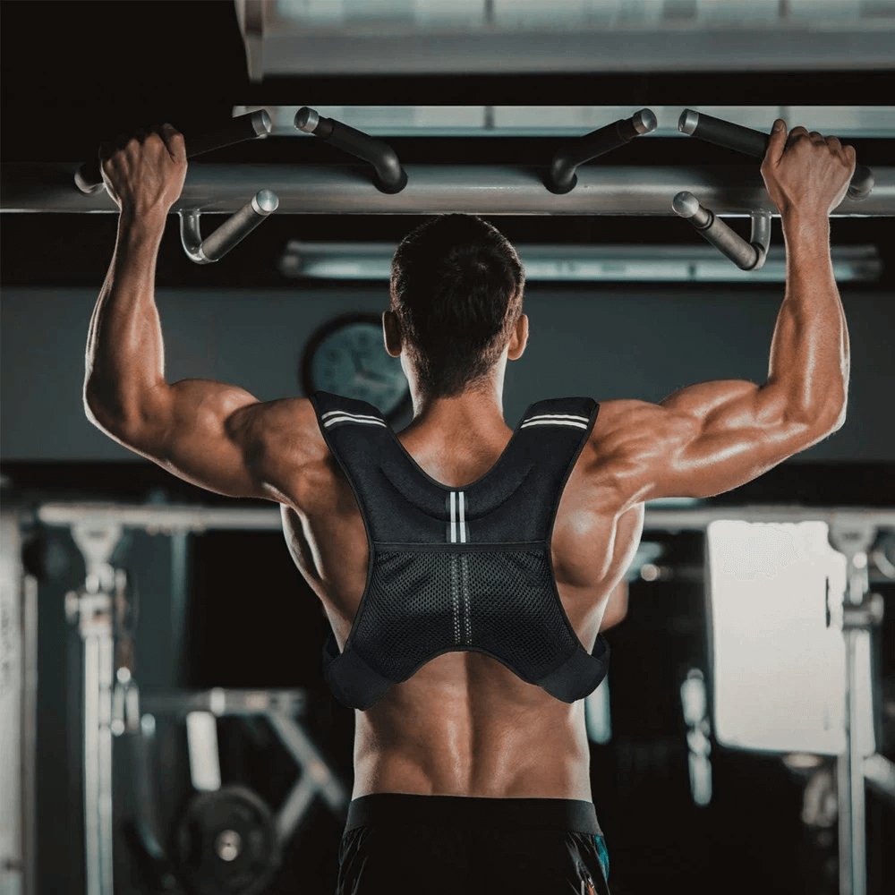 Man using 6lb/8lb Weighted Vest for Running Training - SF3432 during gym workout, showcasing muscle strength and vest features.