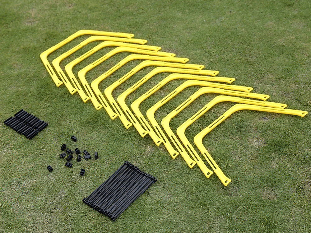 6Pcs Modular Hexagonal Hurdles and Connectors Set SF3169 on grass for agility training, includes vibrant yellow hurdles and connectors.