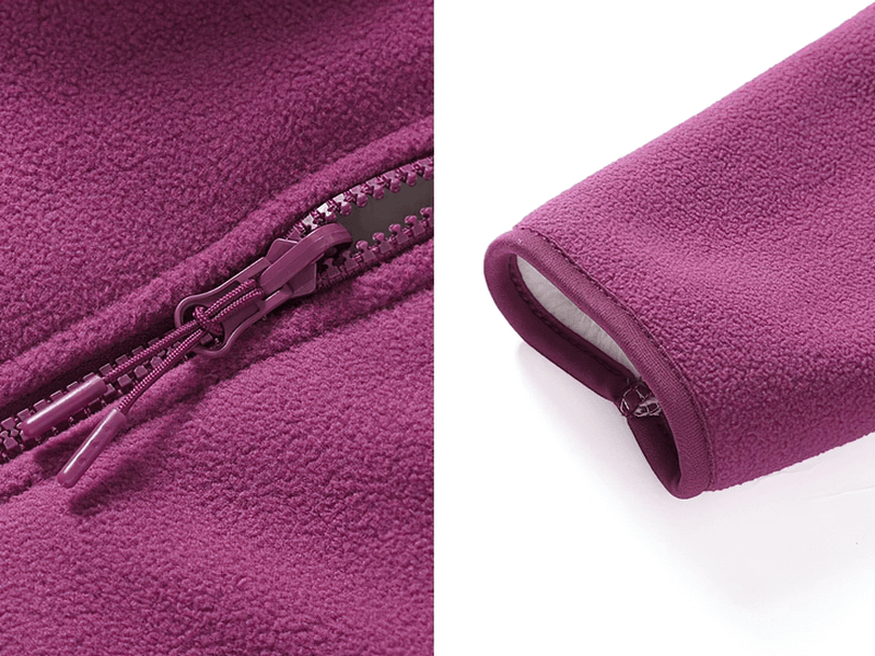 Close-up of a purple zip-up fleece jacket showcasing the zipper and sleeve cuff detail, highlighting the soft, warm fabric texture.