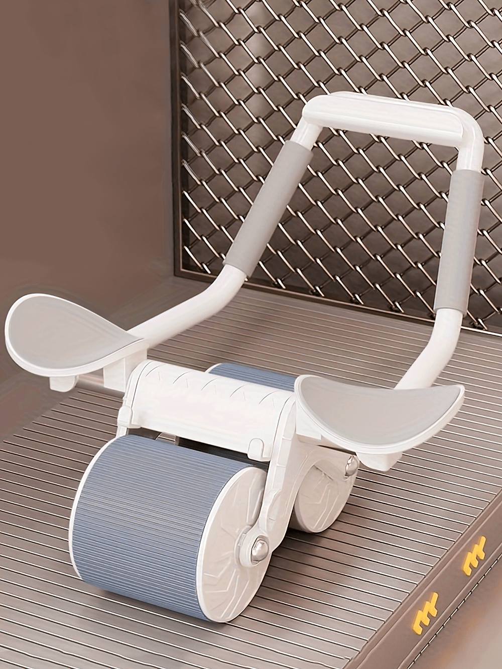 Ab roller with triangular support and wide wheels for core workouts, featuring ergonomic elbow rests and automatic rebound function.