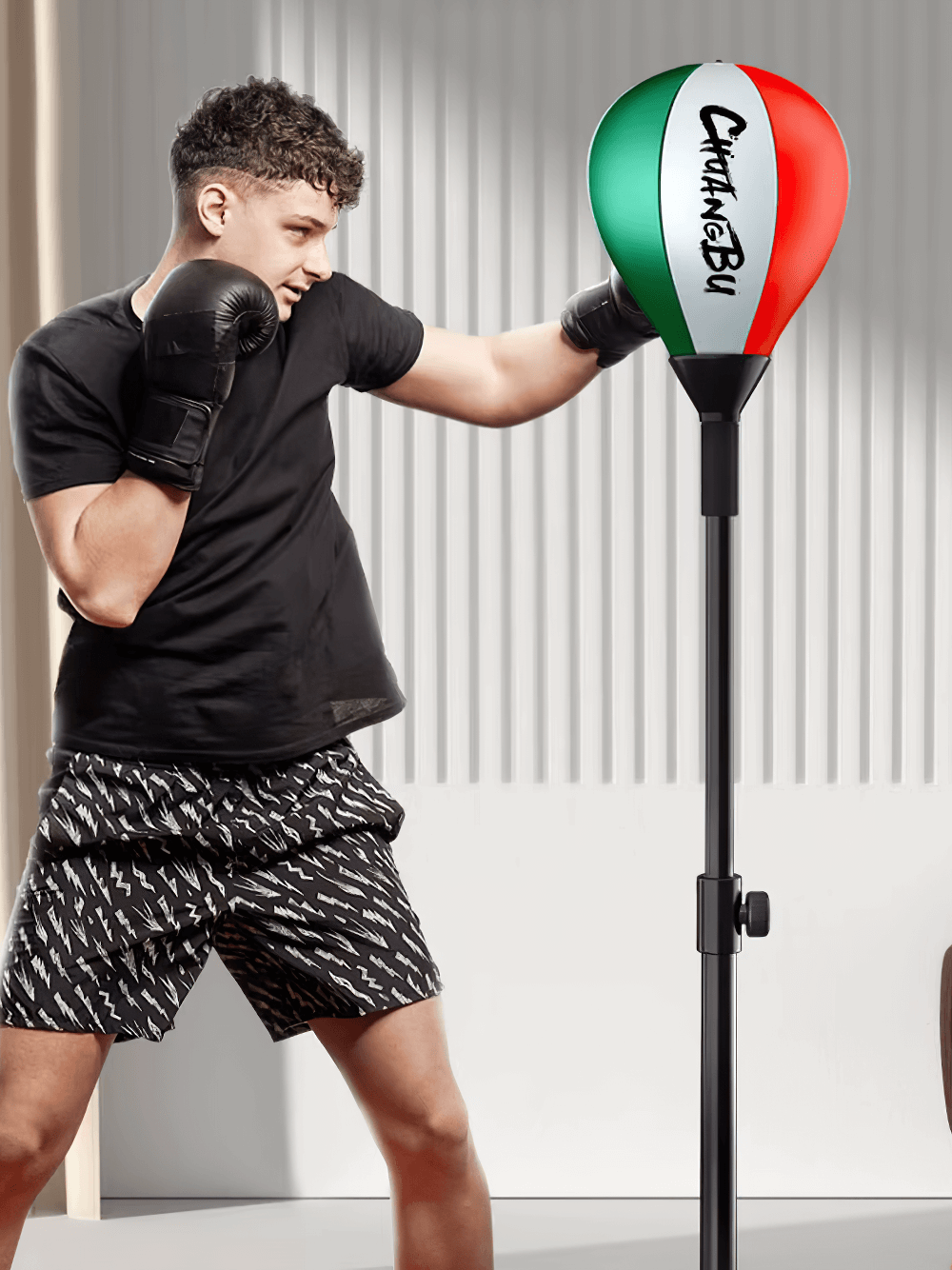 Man practicing with Adjustable Freestanding Reflex Punching Bag SF2722 at home, enhancing boxing skills and reaction time.