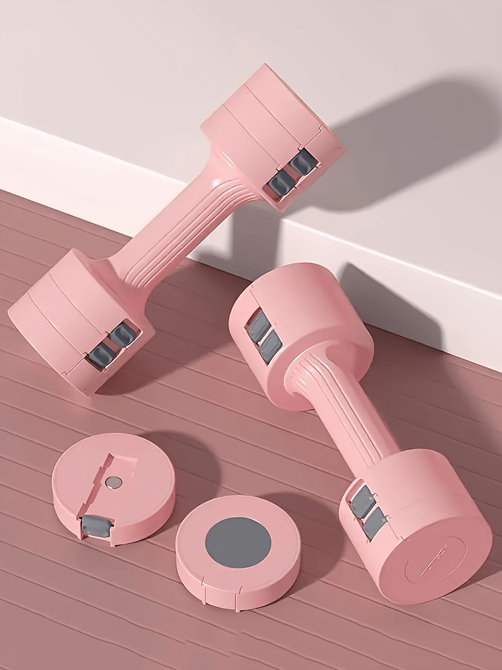 Adjustable pink dumbbells with secure locking for home and gym workouts, ideal for strength training and toning exercises.