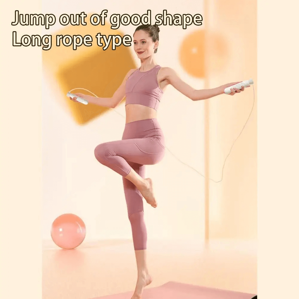 Woman exercising with a long adjustable skipping rope indoors, wearing workout gear.