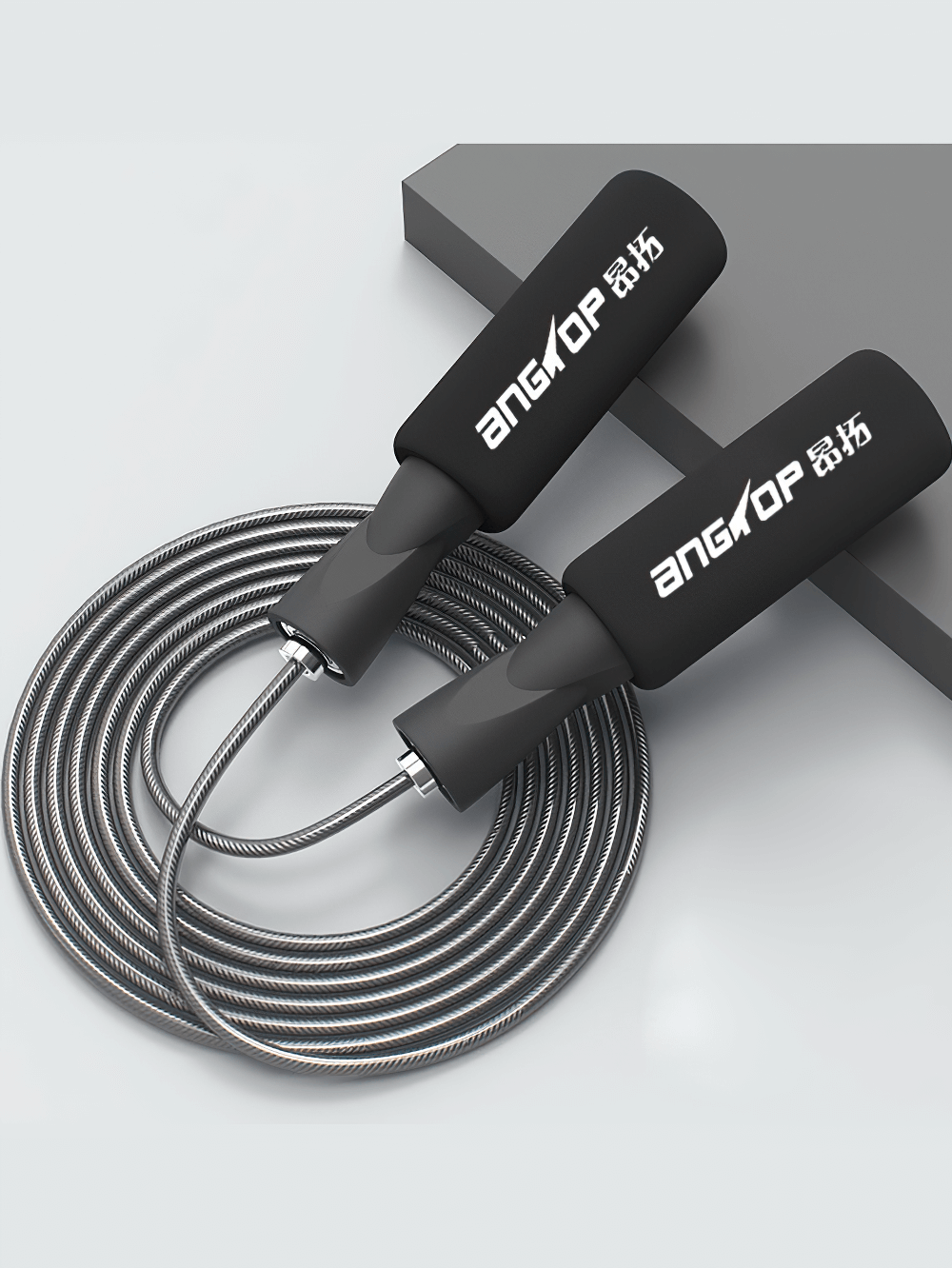 Adjustable speed jump rope with ergonomic foam handles and durable PVC-coated cable, ideal for cardio workouts and fitness training.