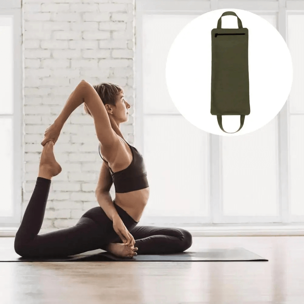 Person practicing yoga with adjustable weighted sandbag for enhanced training, showcasing flexibility and strength.