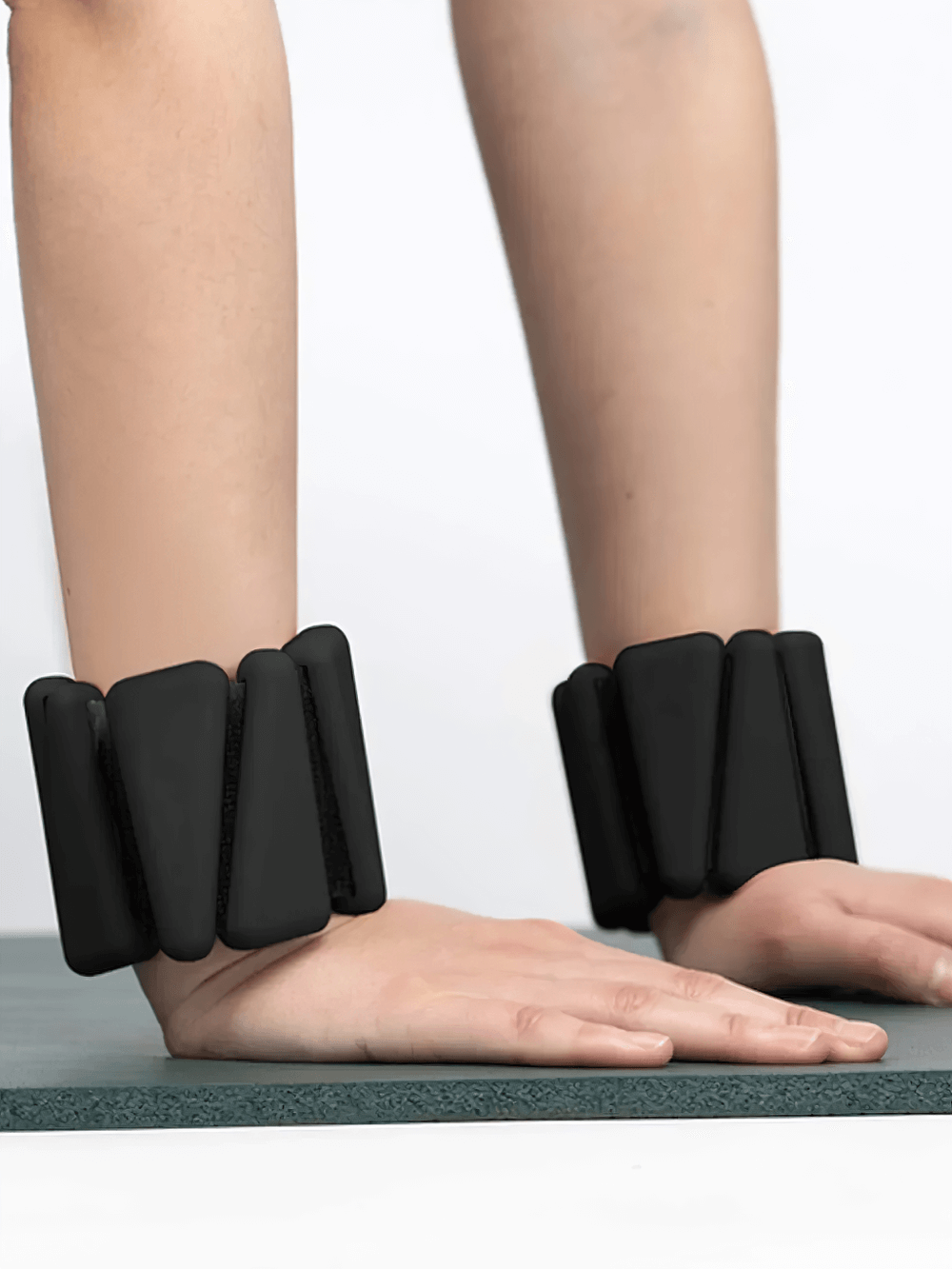 Person exercising with adjustable wrist weights on black yoga mat, showcasing SF3311 model for enhanced cardio and strength training.