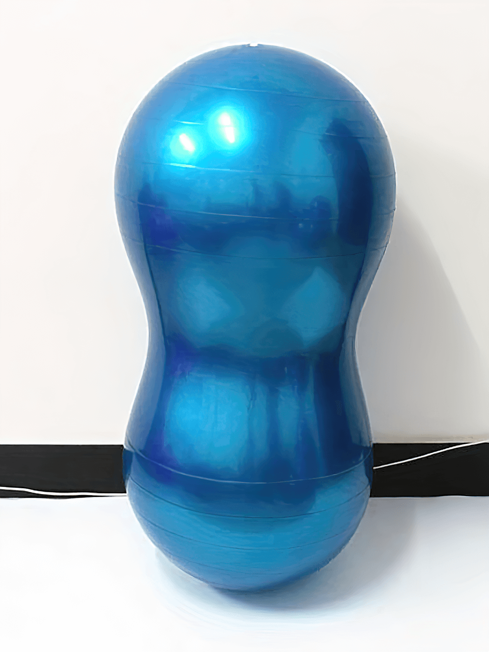 Blue anti-explosion peanut-shaped yoga ball for core strength and physiotherapy, ideal for balance exercises and rehabilitation.