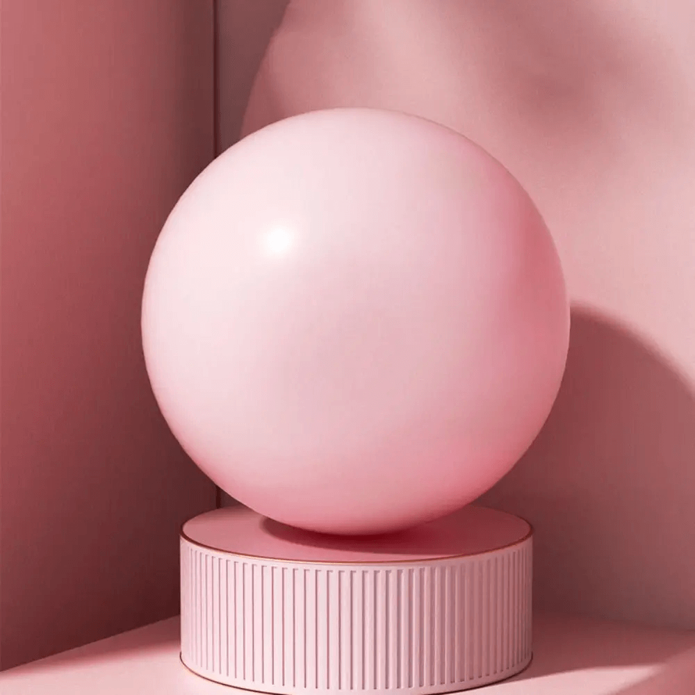 Pink anti-explosion Pilates yoga ball for women’s gym workouts, ideal for leg and hip sculpting, core exercises, and balance training.