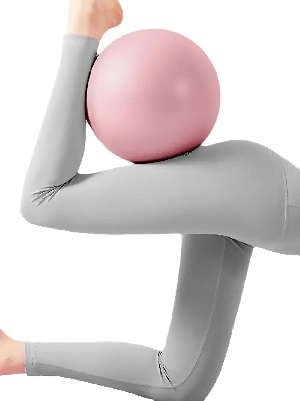 Woman using pink anti-explosion yoga ball for leg and hip workout, enhancing flexibility and balance in a yoga pose.