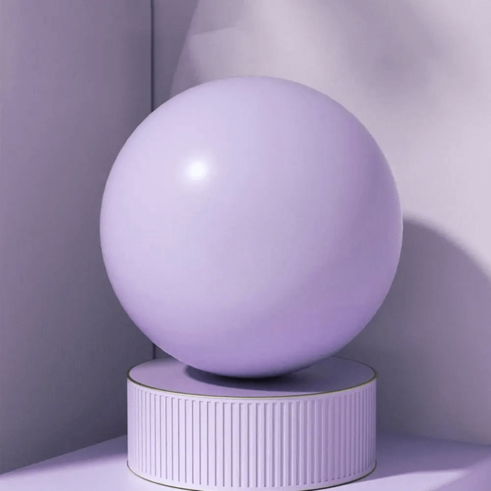 Purple Anti-Explosion Pilates Yoga Ball for Women Gym SF3266 on display stand, ideal for home workouts and core exercises.